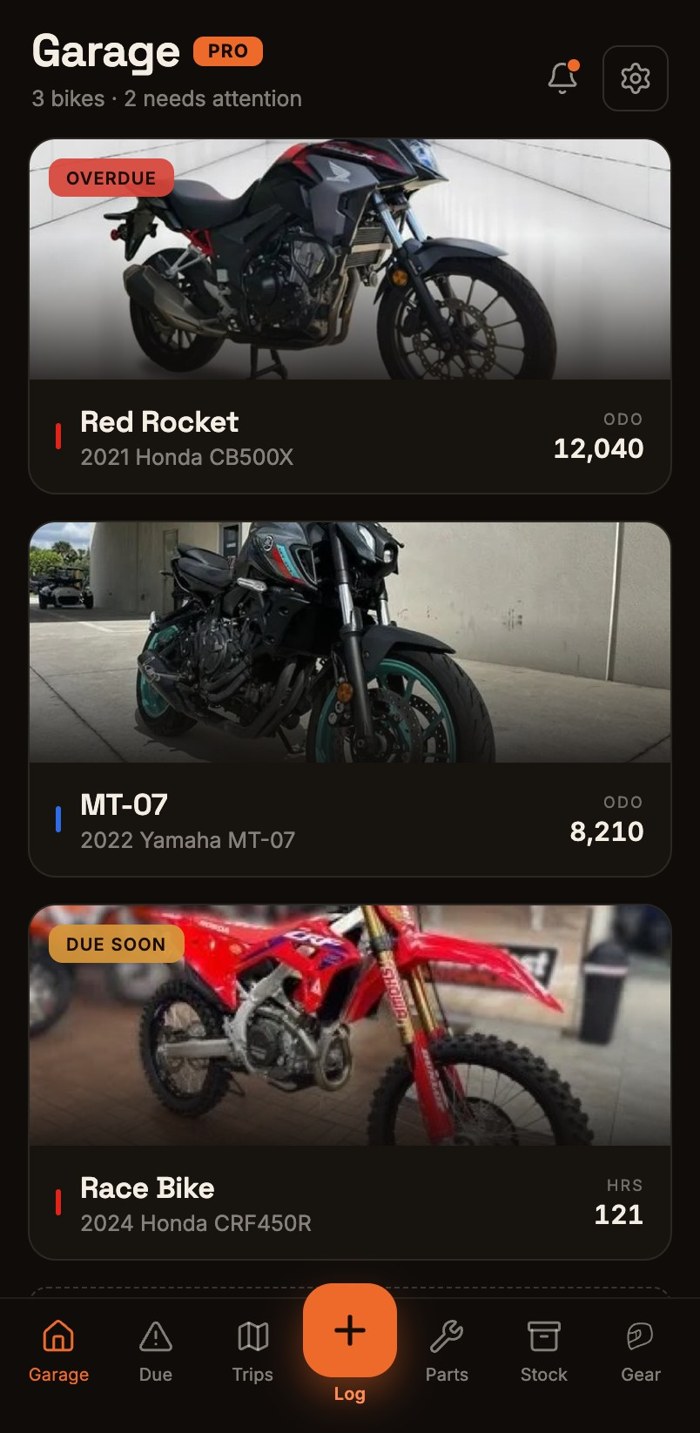 The garage screen in the Moto Garage app on iPhone: three bikes with photos, status badges, and odometer readings